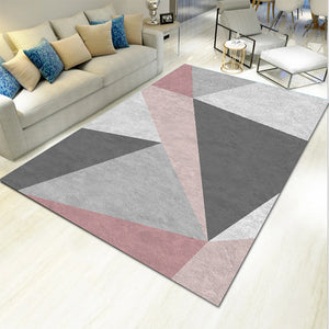 Several light geometric carpet mats